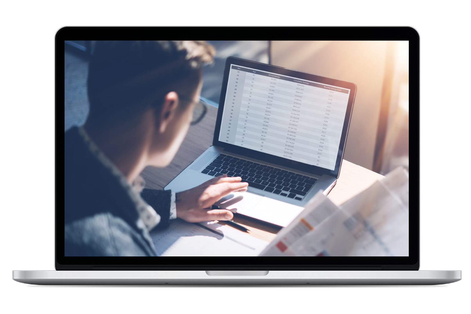 Image of laptop computer with image on the screen of man viewing a spreadsheet on a computer